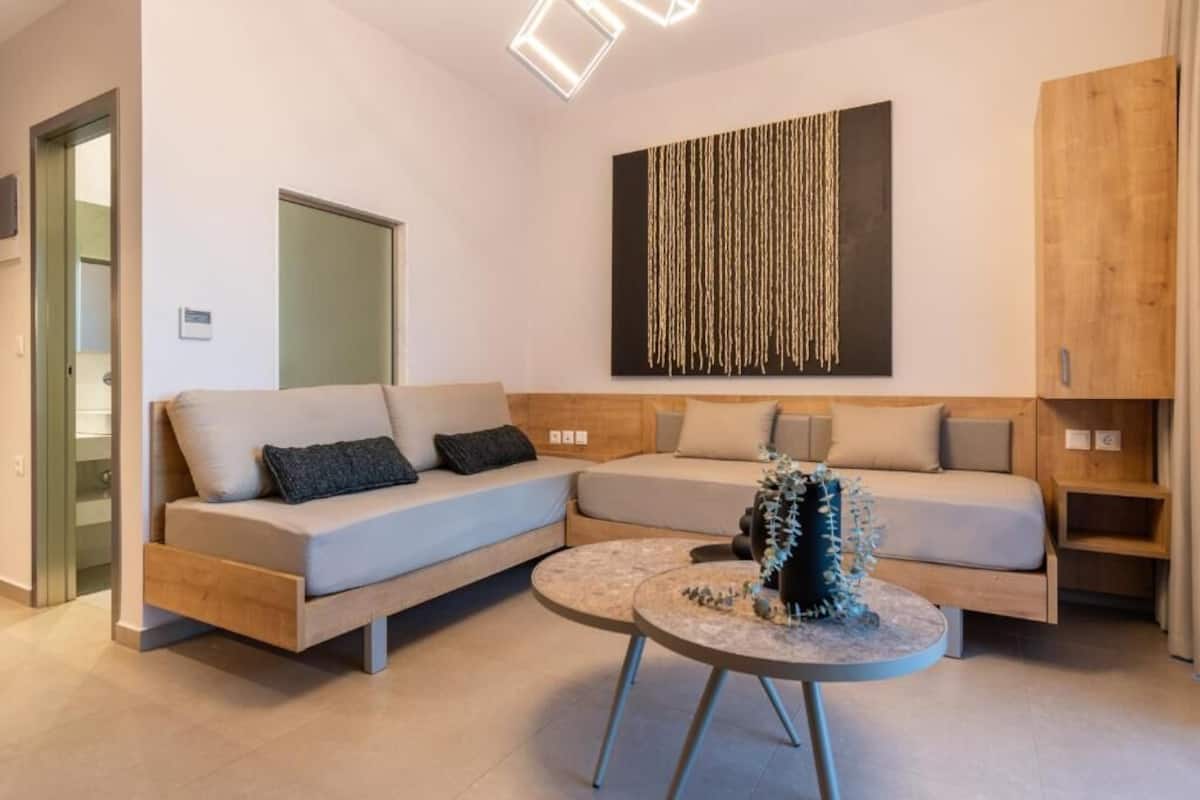 Family Suite, Balcony, Partial Sea View | Living area | 40-inch Smart TV with cable channels