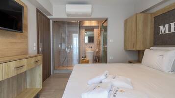 Exclusive Suite, Balcony, Partial Sea View | Bathroom | Shower, hydromassage showerhead, hair dryer, towels