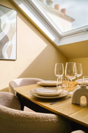 A dining area with a table set for two, including plates, glasses, and cutlery. - 4G. 3-Bedroom Apartment for 6 People, Paris 15th Arrondissement, AC (Paris)