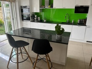 Coffee/tea maker, fridge, microwave, oven