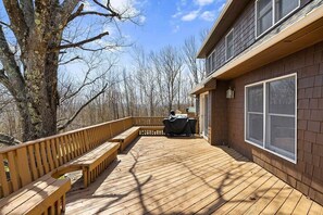 A wooden deck with benches, a covered barbecue area, and a house with large windows. - Luxury Windham Retreat w/ Hot Tub & Fireplace, Mins to Slopes (Windham)