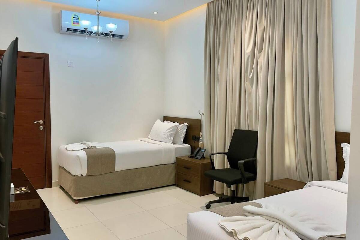 Premium bedding, desk, laptop workspace, iron/ironing board (on request)