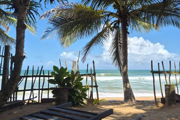 On the beach, white sand, sun loungers, beach towels