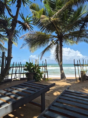On the beach, white sand, sun-loungers, beach towels - NATIVE SOULS Beach Hotel (Induruwa)