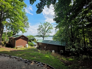 Neighboring cabins with the lake beyond the trees. Enjoy full visibility in the winter and privacy in the summer.