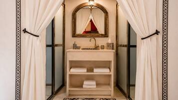 Separate tub and shower, towels, soap, shampoo