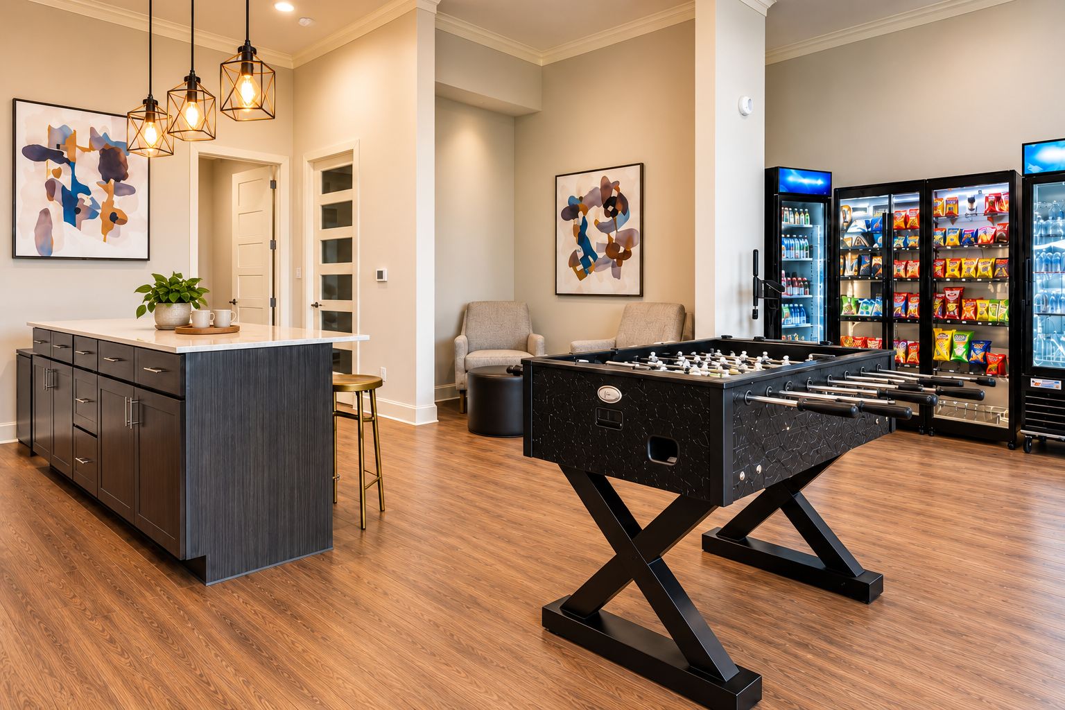 A modern kitchen with a foosball table, bar area, and a refrigerator stocked with beverages.