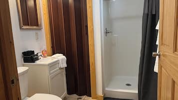 Shower, towels, soap, toilet paper