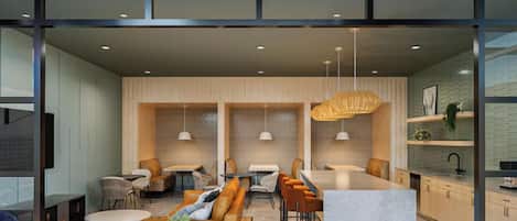 A modern interior with a bar area, seating, and a kitchen visible through glass partitions.