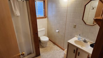 Shower, towels, soap, toilet paper