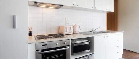 Coffee/tea maker, fridge, microwave, oven
