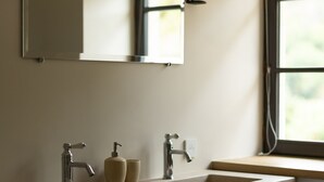 A bathroom with a wooden vanity, a mirror, two wall-mounted lights, and a window with a view. - AUBERGE DE MARIGNA (Marigna-sur-Valouse)