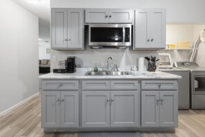 Coffee/tea maker, fridge, microwave, oven