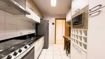 Family Apartment, Beach View | Private kitchen | Coffee/tea maker, full-size fridge, microwave, oven