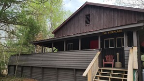 A rustic wooden building labeled 'The Fireplace' with a wooden staircase leading to a porch area.