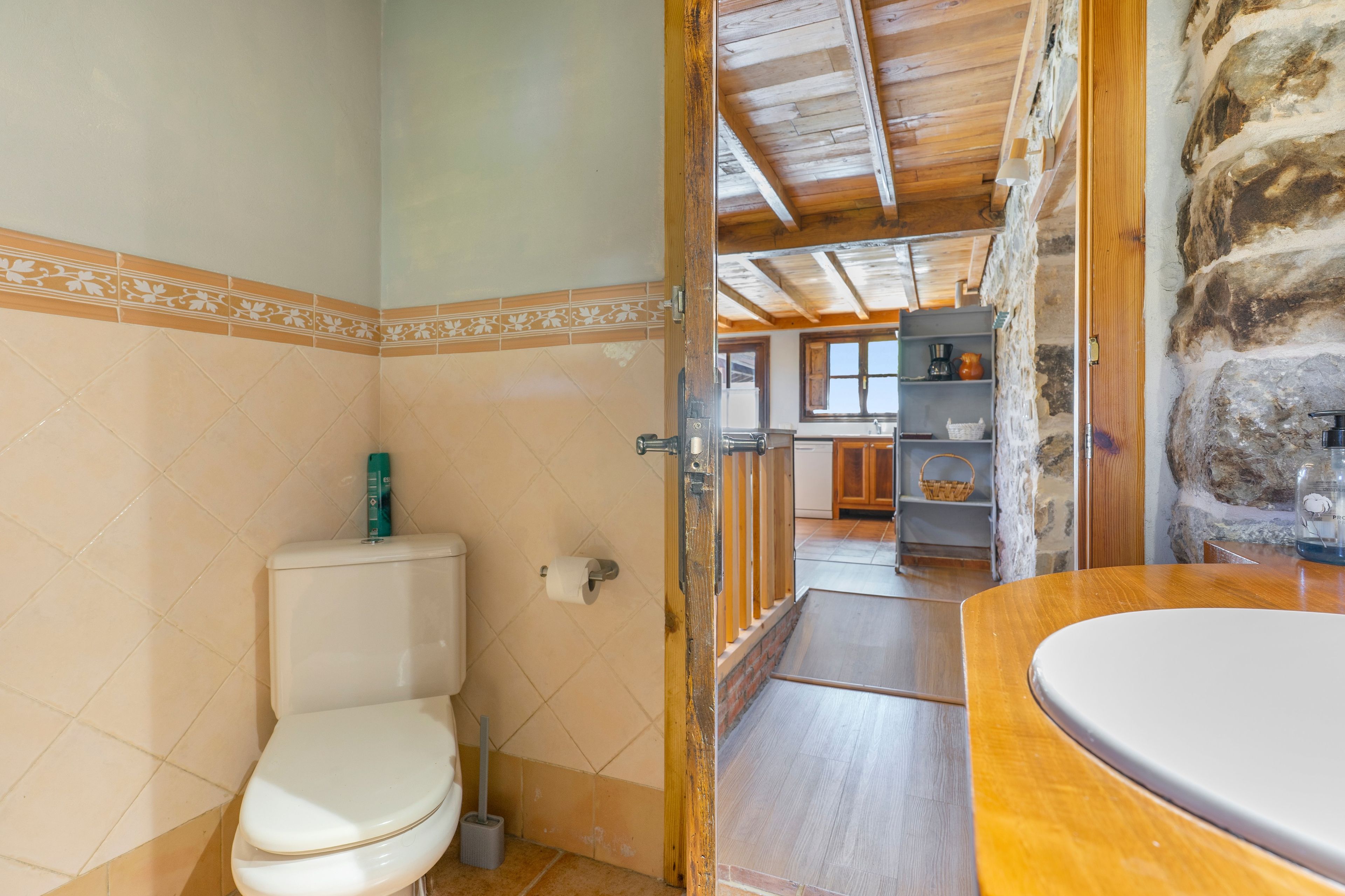 A bathroom with a toilet, a bidet, and a sink.