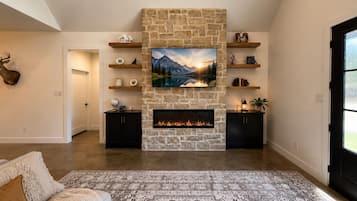 Smart TV, fireplace, books, printers