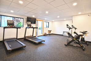 A fitness center with treadmills, an elliptical, and a stationary bike. - Near Canyons Ski Lift w/ Communal Hot Tub (Park City)