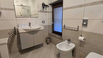 Hair dryer, towels, soap, shampoo