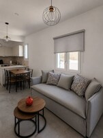 Luxury Apartment, Sea View | Living area | 43-inch Smart TV with digital channels