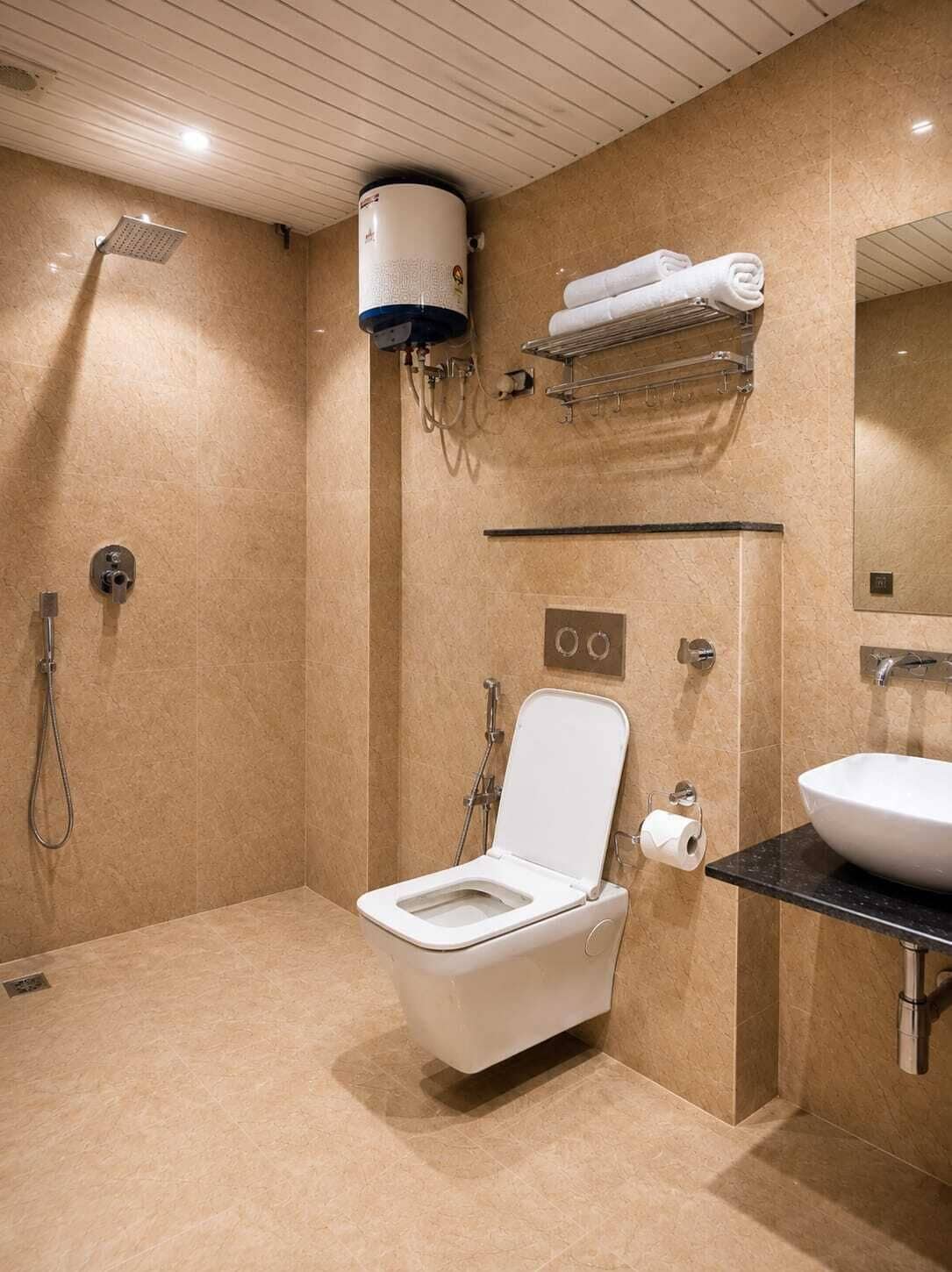 A modern bathroom with a toilet, sink, shower, and towel rack.