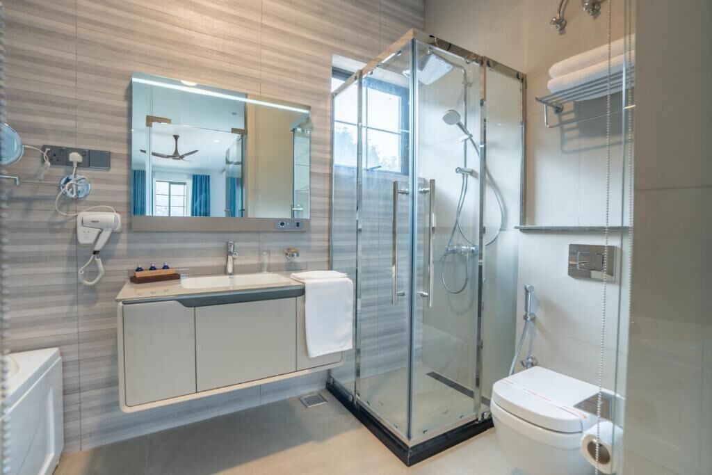 Combined shower/tub, hair dryer, towels, toilet paper
