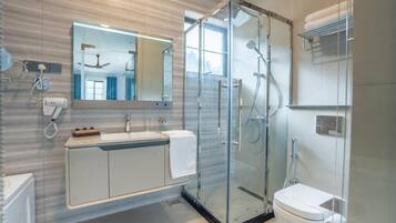 Combined shower/tub, hair dryer, towels, toilet paper