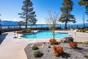 A swimming pool with a view of a lake and mountains in the background. - Waterfront Tahoe Keys Condo. Private Boat Dock, Lake Views & Family Friendly (South Lake Tahoe)