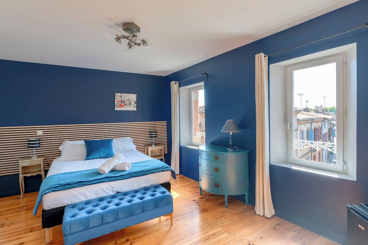 Suite Marguerite, street view | In-room safe, desk, laptop workspace, blackout drapes