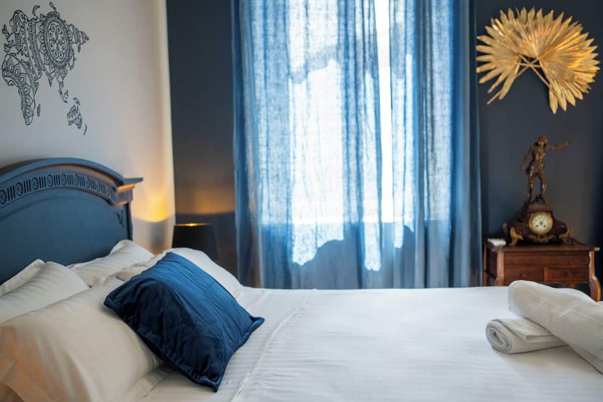 Suite Flore, street view | In-room safe, desk, laptop workspace, blackout drapes
