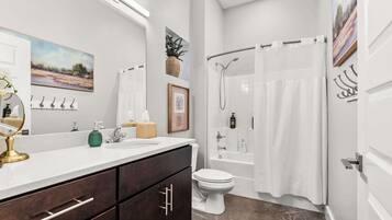Shower, hair dryer, towels, shampoo