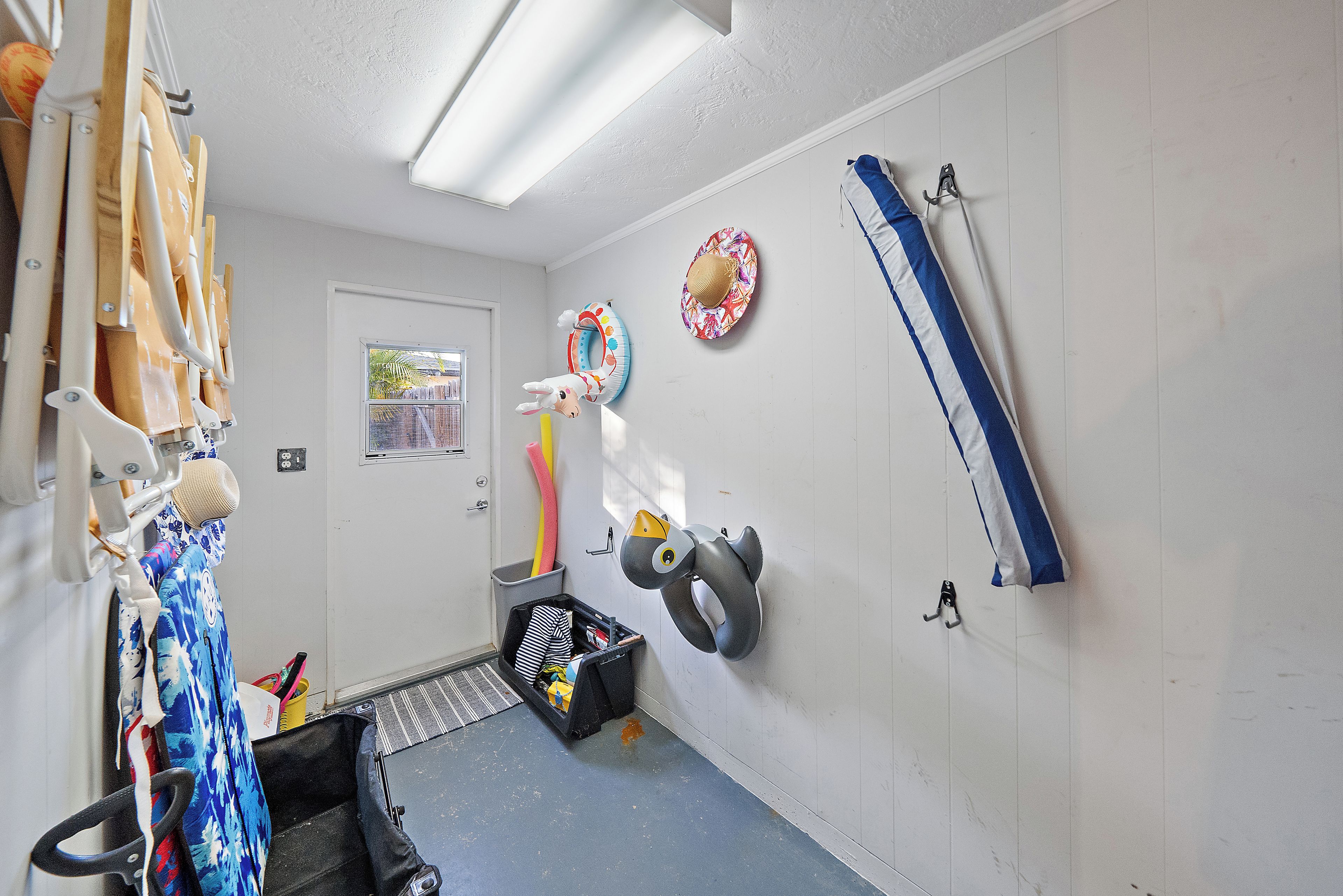 A room with a door, a window, a wall-mounted ring light, a wall-mounted towel rack, a wall-mounted towel rack, a wall-mounted towel rack, a wall-mounted towel rack, a wall-mounted towel rack, a wall-mounted towel rack, a wall-mounted towel rack, a wall-mounted towel rack, a wall-mounted towel rack, a wall-mounted towel rack, a wall-mounted towel rack, a wall-mounted towel rack, a wall-mounted towel rack, a wall-mounted towel rack, a wall-mounted towel rack, a wall-mounted towel rack, a wall-mounted towel rack, a wall-mounted towel rack, a wall-mounted towel rack, a wall-mounted towel rack, a wall-mounted towel rack, a wall-mounted towel rack, a wall-mounted towel rack, a wall-mounted towel rack, a wall-mounted towel rack, a wall-mounted towel rack, a wall-mounted towel rack, a wall-mounted towel rack, a wall-mounted towel rack, a wall-mounted towel rack, a wall