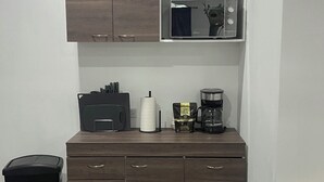A compact kitchenette with a microwave, coffee maker, and storage drawers. - Vila #3, spacious private villa fits 7 people w/ AC in gorgeous La Costa del Sol (San Pedro Masahuat)