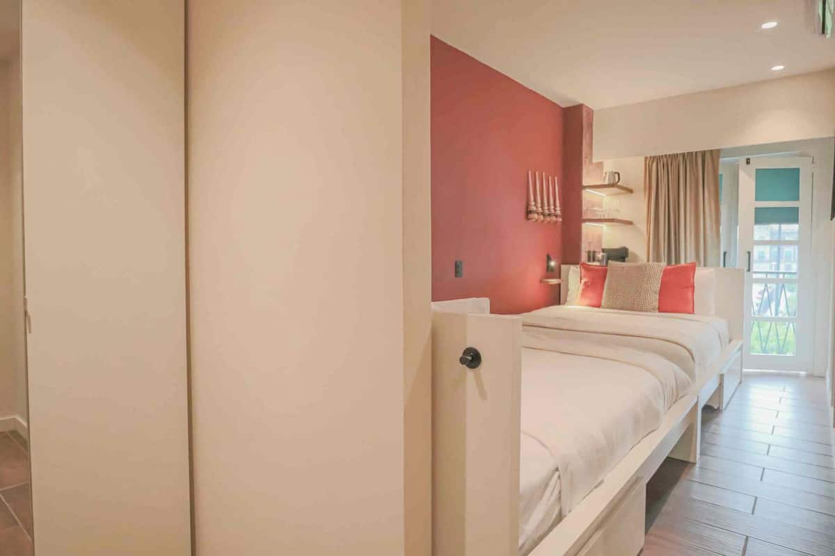 Room, 2 Queen Beds, City View | Minibar, in-room safe, blackout drapes, iron/ironing board