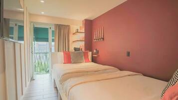 Room, 2 Queen Beds | Minibar, in-room safe, blackout curtains, iron/ironing board