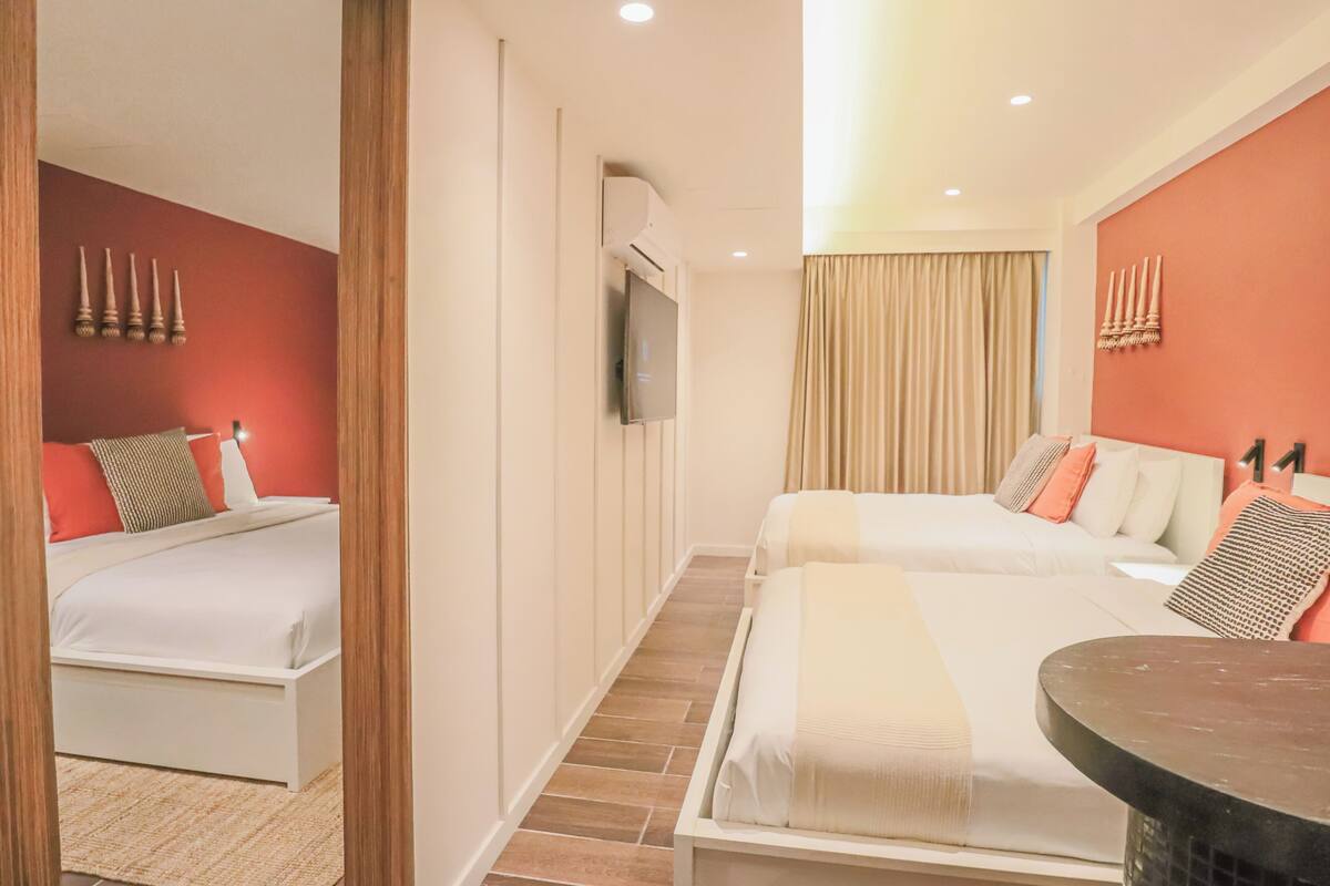 Family Suite, Courtyard View | Minibar, in-room safe, blackout drapes, iron/ironing board