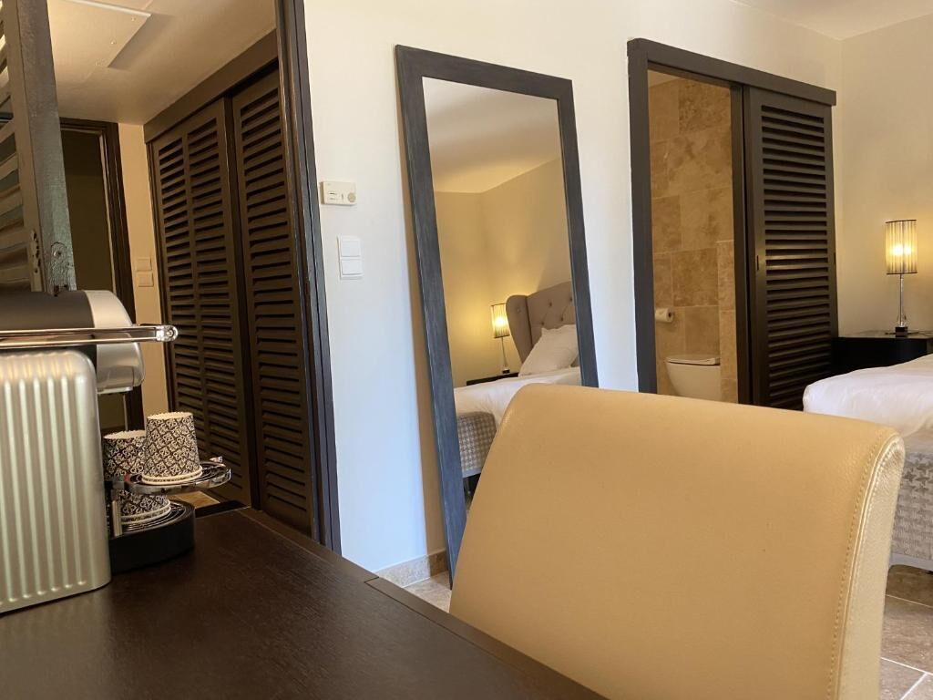 Junior Double Room, Patio, Garden View | In-room safe, desk, iron/ironing board (on request), free WiFi