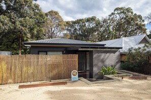 A modern two-story house with a dark roof and brick exterior. - House Kayu - A unique home in the heart of Margaret River (Margaret River)