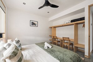 A bedroom with a bed, a desk, and a wardrobe. - House Kayu - A unique home in the heart of Margaret River (Margaret River)