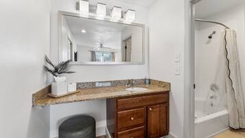 Shower, hair dryer, towels, shampoo