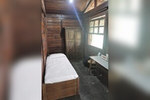 A small, compact room with a single bed, a desk, and a window. - Country house on the reservoir with beach, kayaking, fishing and waterfall. (Juquitiba)