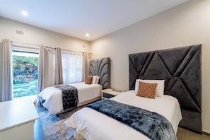Twin Room, Patio, Garden View | Laptop workspace, blackout drapes, soundproofing, iron/ironing board - Cosmo Guest House (Victoria Falls)