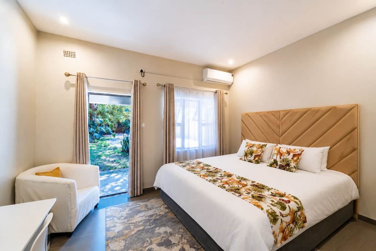 Double Room, Patio, Garden View | Laptop workspace, blackout drapes, soundproofing, iron/ironing board