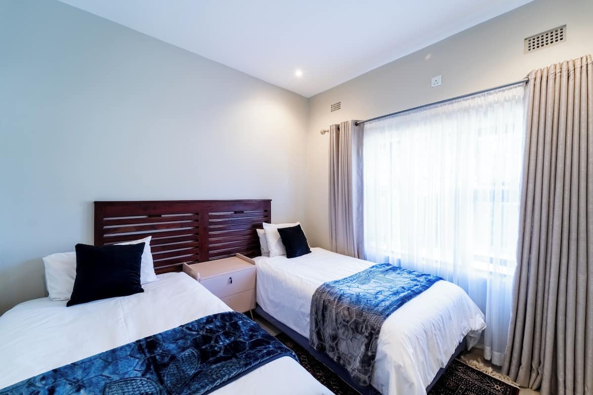 Twin Room, Patio, Garden View | Laptop workspace, blackout drapes, soundproofing, iron/ironing board
