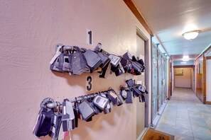 A hallway with multiple padlocks on the wall, numbered 1 and 3. - Hawaiian King: Spacious 1-bedroom apt in central Waikiki, 0.3ml to beach, Pool (Honolulu)