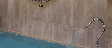 A spa area with a sign reading 'Don Gregorio SPA' and a water feature.