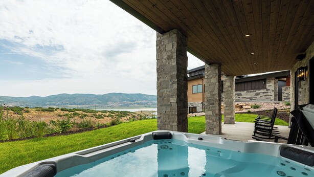 A hot tub with a view of a mountainous landscape. - NEW Luxury Retreat in Deer Valley East, Free Ski Shuttle, Hot Tub, Sleeps 18 (Heber City)