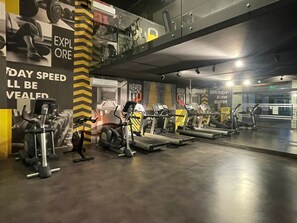 A gym with treadmills, stationary bikes, and weight machines. - Quiet Studio, Best Price, and Near the Metro (Santiago)