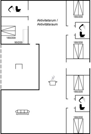 Un aménagement de chambre d’hôtel comprenant une kitchenette, un canapé et un espace douche.