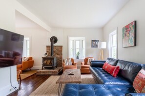 TV, fireplace, books, computer monitors